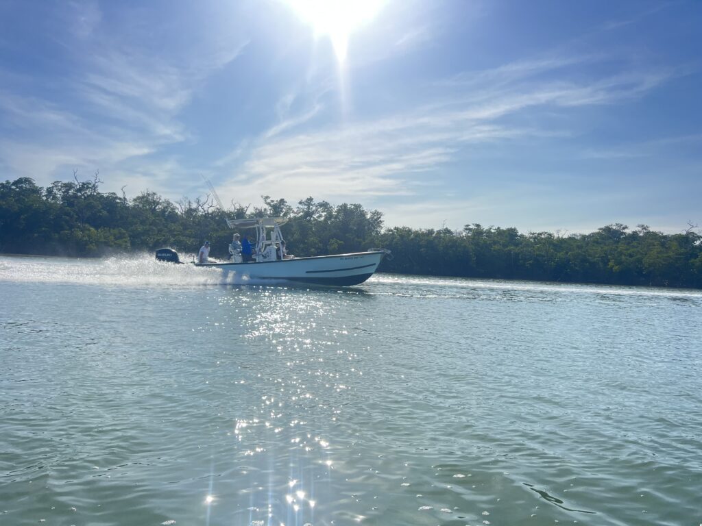 Naples charter boat underway on sunny water